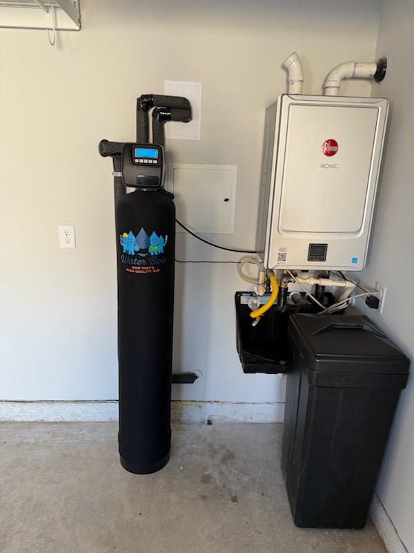 Branded Water Bois tank installed beside a tankless water heater